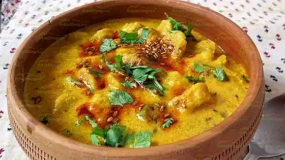 Authentic Rajasthani Atta Chakki Sabji Recipe (Wholesome Wheat Dumpling Curry)